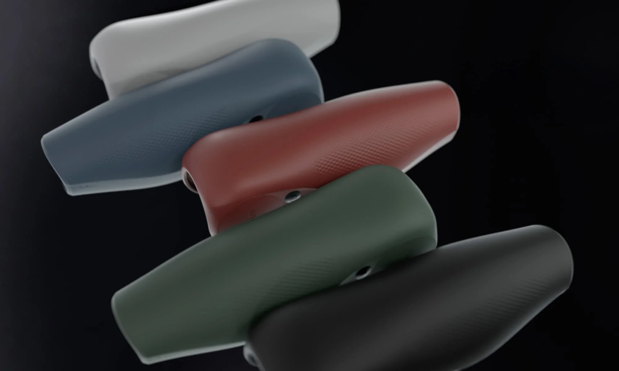 Five Navii prosthetic knee covers in light gray, blue, red, green, and black