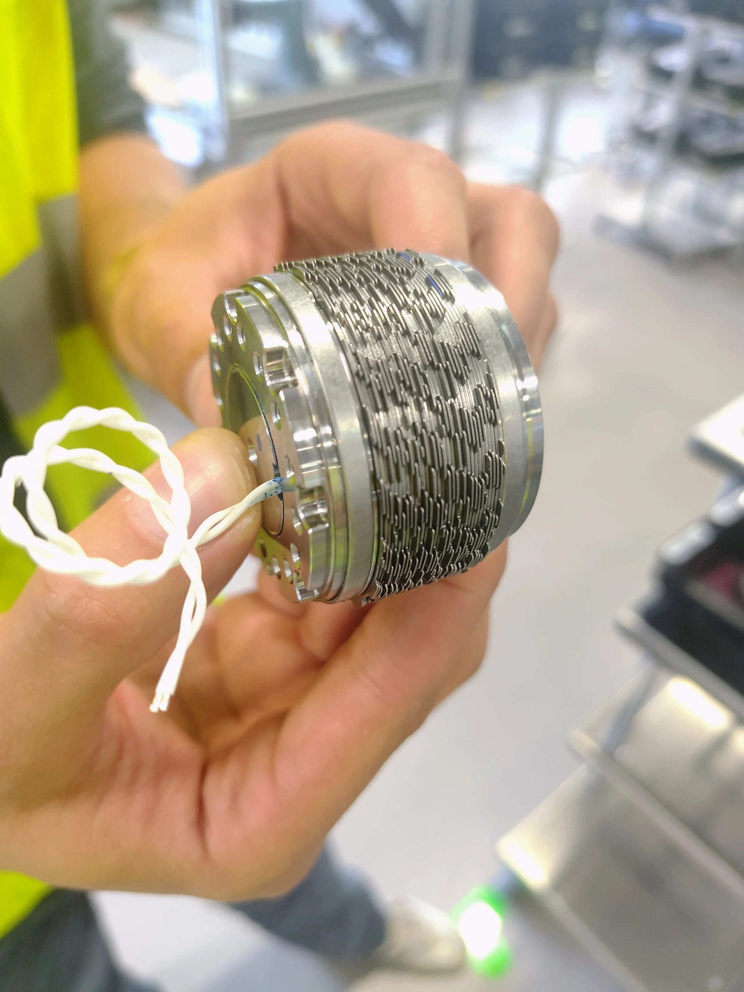 Close-up of the stacked metal rotor and stator elements from an Össur magnetorheological prosthetic knee actuator.
