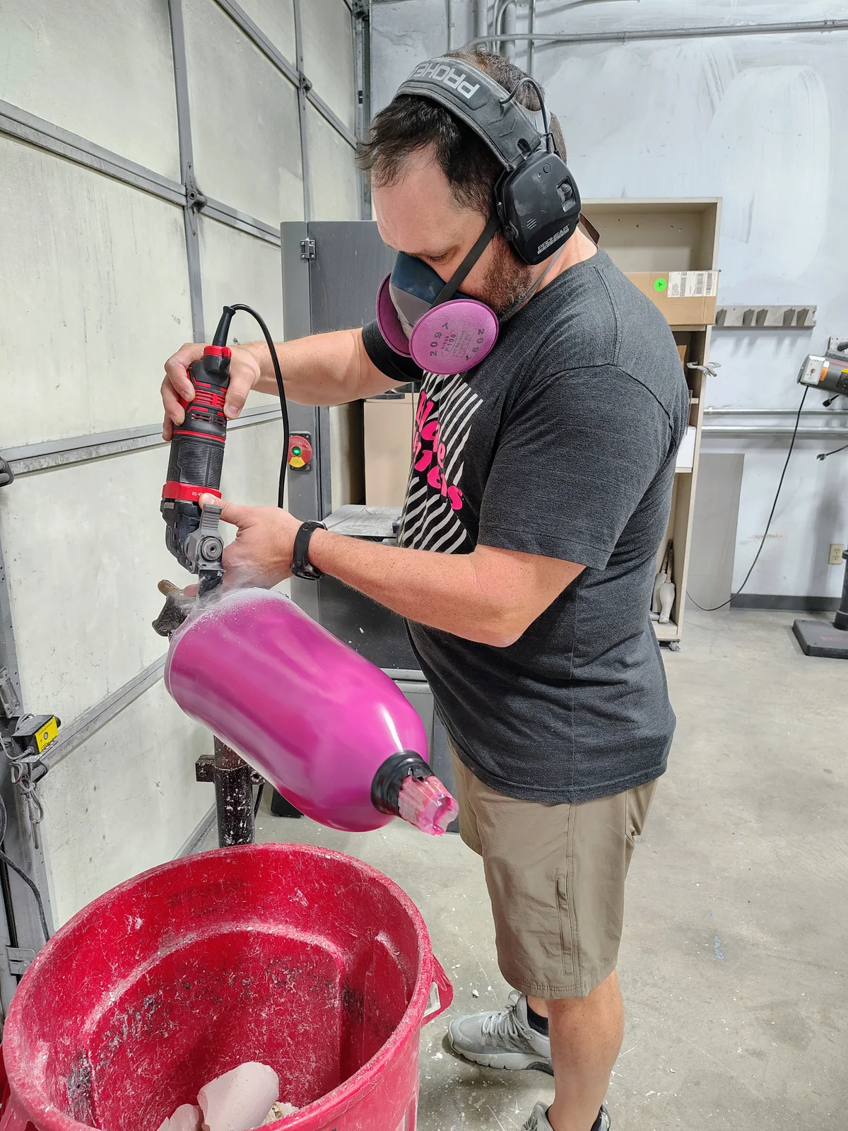 A FabCo technician trimming excess material from a prosthetic socket