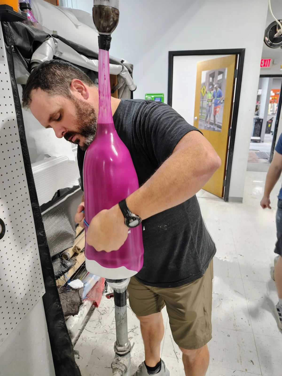 A FabCo technician preparing a prosthetic socket for lamination